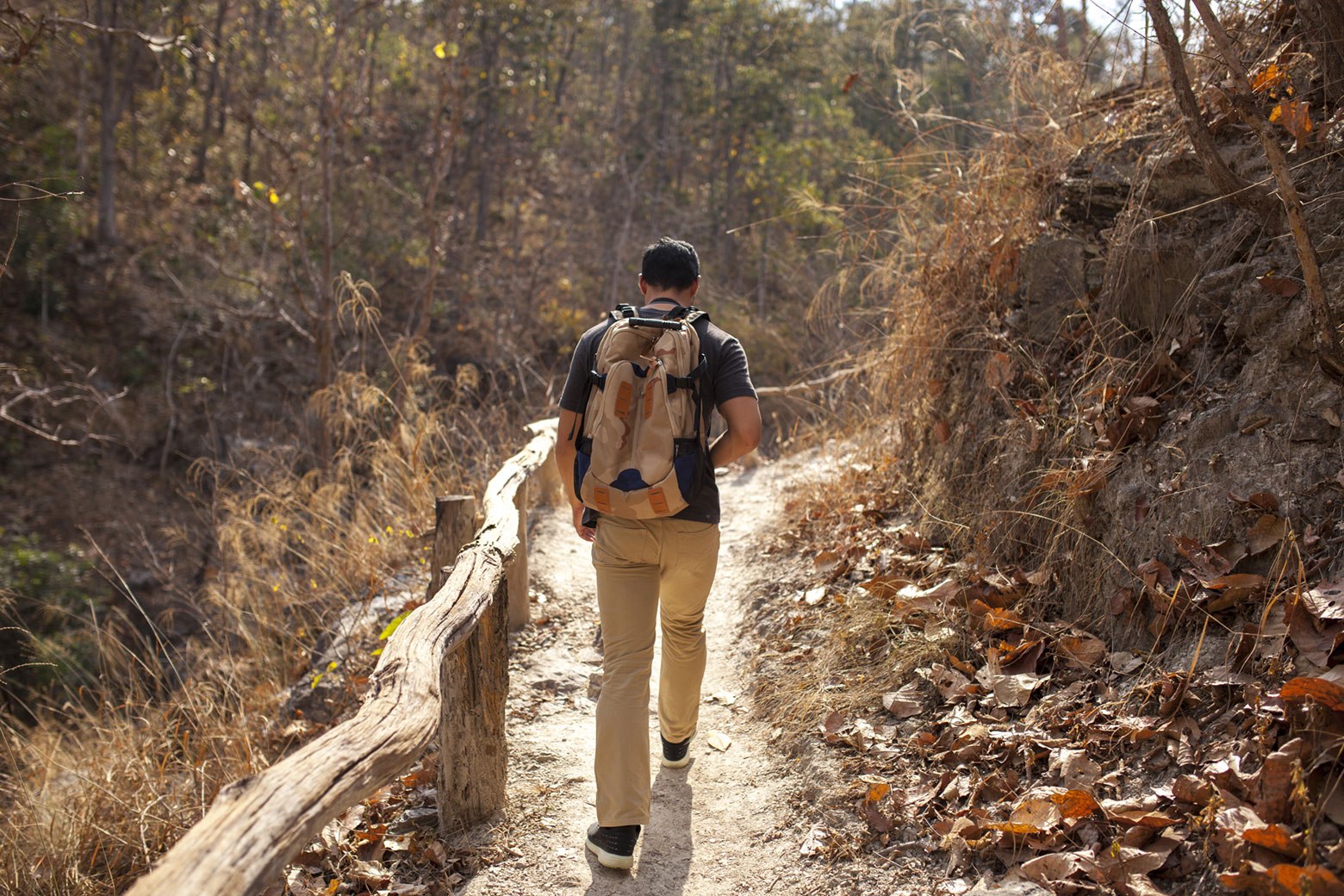 Hiker on a trail in the autumn.