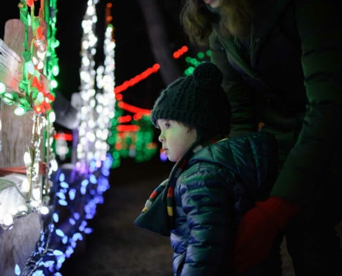 A child enjoying the holiday lights hung in Winter in Gatlinburg, Tennessee.